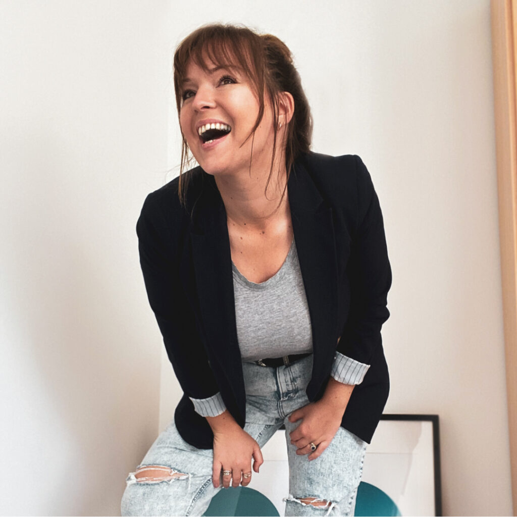 Katie (from Katie Rhona Photography) leaning towards the camera and smiling broadly